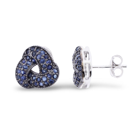 Sterling silver knot-shaped stud earrings with pavé-set blue sapphires covering the twisted design with post and butterfly backs