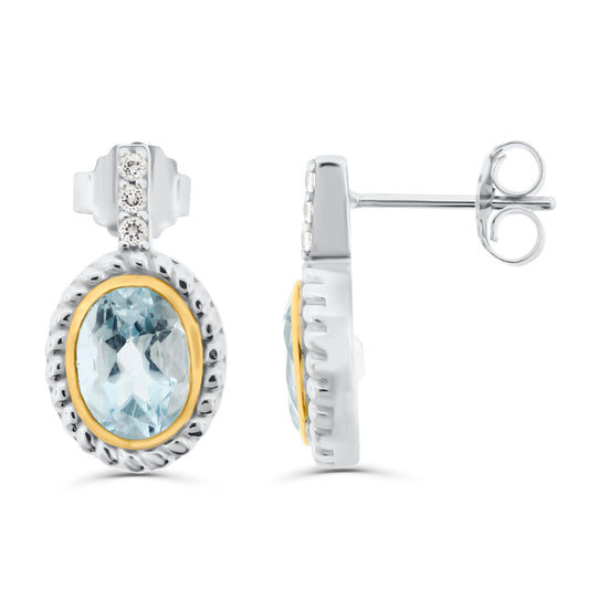 Sterling silver drop earrings with oval sky blue topaz in gold-plated bezels, rope-twist frames, and white topaz accent details